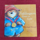 Harper Collins Paddington Goes for the Gold, Paperback Story Books | Condition: Pre Loved